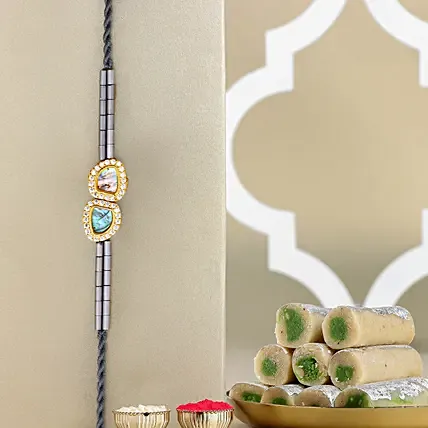 Regal Crest Beads Rakhiand Kaju Roll: Rakhi with Sweets
