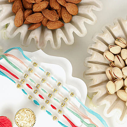 Understated Elegance Rakhi Bundle Set of 5 With Almonds and Pistachio: Rakhi With Dryfruits