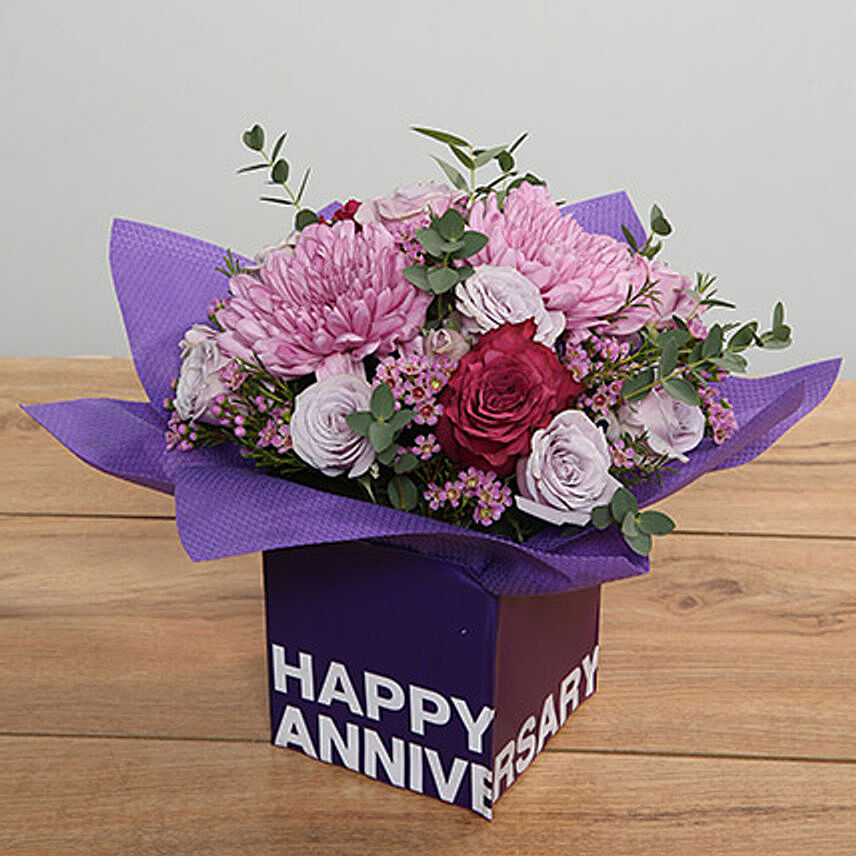 Purple Flowers Arrangement In Square Glass Vase OM