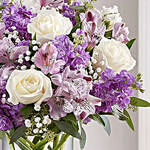 Purple And White Floral Bunch In Glass Vase
