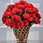 Red Roses In Cane Vase