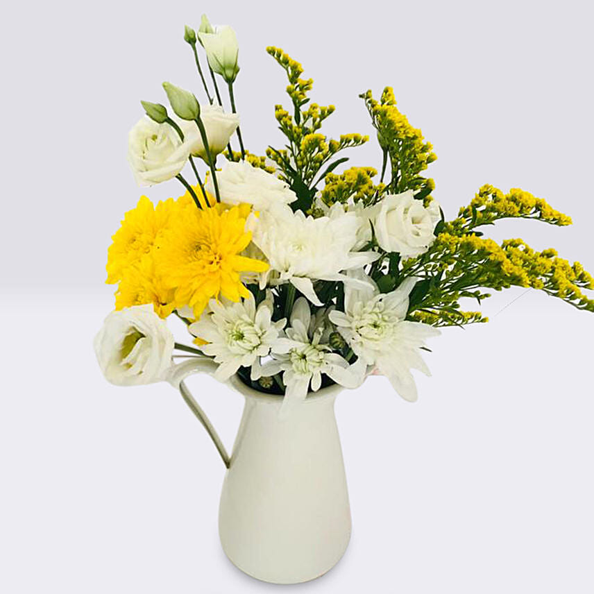 Mix Flowers In A White Handle Vase