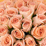 باقة ورد 35 وردة جورية لون مشمشي في غلاف أنيق وببيونة