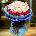 باقة 50 وردة جوري وردي وفوشي في غلاف أزرق جميل