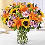 Vibrant Bunch of Mix Flowers In Glass Vase