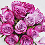 Purple Roses in Glass Bowl