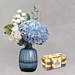 Captivating Mixed Flowers In Blue Glass Vase With Ferrero Rocher