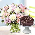 Pink and White Floral In Glass Vase With Hazelnut Cake