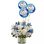 Blue and White Flower Arrangement With Balloons