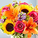 Bright Vivid Bunch Of Flowers In Glass Vase