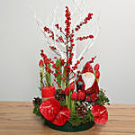 Red Flowers Arrangement With Santa Idol