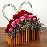 Red and Purple Roses In A Wooden Base