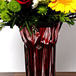 Bright Mixed Flowers In Red Vase