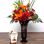 Roses and Asiatic Lilies In Vase With Chocolates