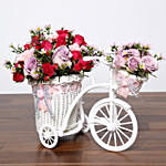 Purple and Pink Flowers In Cycle Basket