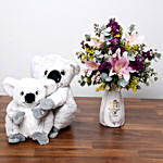 Pink and Purple Flowers In Vase With Teddy Bears