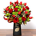 Red Tulips and Roses In Vase With Chocolates