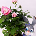 Pink Rose Plant In Rabbit Cart Pot