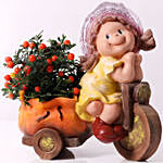 Solanum Plant In Little Girl Cart Pot