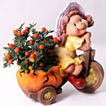 Solanum Plant In Little Girl Cart Pot