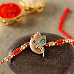Alluring Rose Gold Ganesha Rakhi With Almonds
