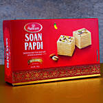Set of 4 Pearl Thread Rakhis And Box of Soan Papdi