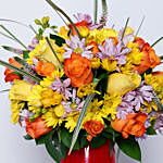 Enticing Mixed Flowers In Red Designer Vase