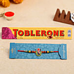 Multicoloured Lord Ganesha Rakhi And Toblerone Chocolate