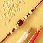 Red Beads Pearl Designer Rakhi And 3 Pcs Ferrero Rocher