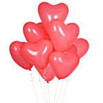 Red Heart Shape Balloons With Flowers and Fudge Cake