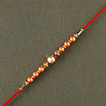 Rose Gold Pearl And Beads Rakhi with 3 Ferrero Rocher and Almonds