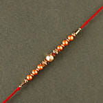 Rose Gold Pearl And Beads Rakhi with 3 Ferrero Rocher and Almonds