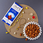 Sneh Butterfly Rakhi and 100 Grams Almonds with Lindt bar