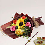 Vibrant Artificial Mixed Flowers Bouquet With Rakhi