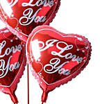 3 بالونات فويل حمراء معبأة بالهيليوم على شكل قلب مع نص أحبك