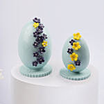 Ester Eggs In Flower Arrangement And Easter Chocolates