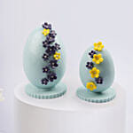 Ester Eggs In Flower Arrangement And Easter Chocolates