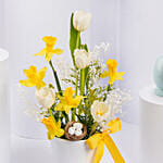 Ester Eggs In Flower Arrangement And Easter Chocolates