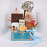 Divine Rudraksh Rakhi In Gift Box With Chocolates And Floral Arrangement