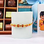 Divine Rudraksh Rakhi In Gift Box With Chocolates And Floral Arrangement