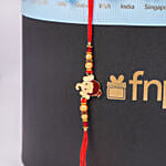 Ganesha Kids Rakhi Hamper With Chocolates In Black Round Box