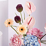 Colorful Flower Arrangement in White Vase