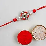 Appealing Floral Rakhi Set And Soan Papdi