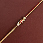 Crimson Majestic Pearl Rakhi N Rasgulla