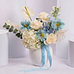 Elegant Blue and White Flower Arrangement in Ceramic Vase
