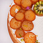 Rakhi Special One Kg Vanilla Cake Topped With Gulab Jamun And Kiwi