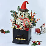 ورد على شكل رجل ثلج في صندوق أسود وشوكولاتة فيريرو روشيه