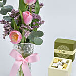 Three Tulips in a Vase With Chocolates