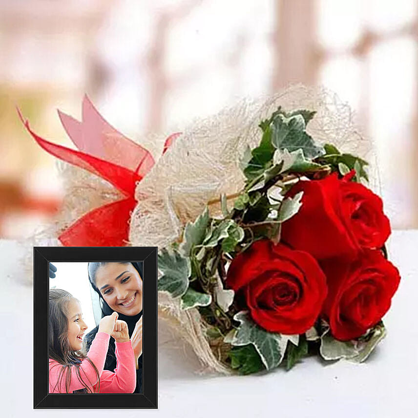 Red Roses Bouquet And Black Photo Frame