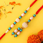 Blue Lumba Rakhi Set And 2 Floral Print Cushions